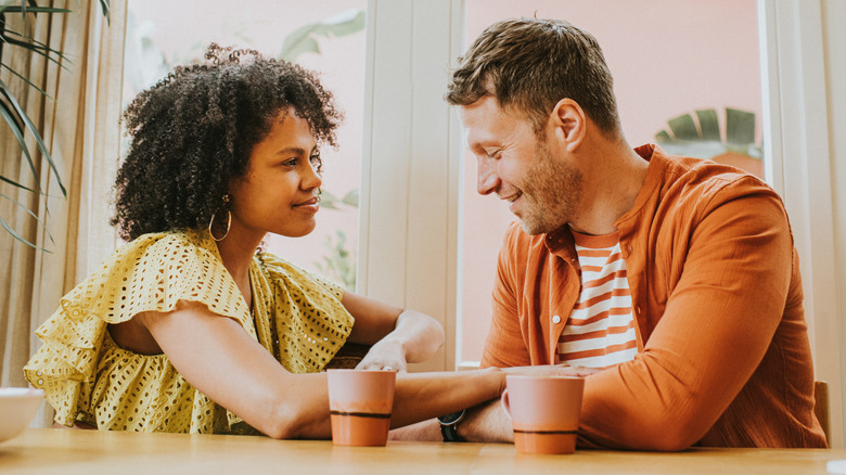 Man and woman talking with coffee