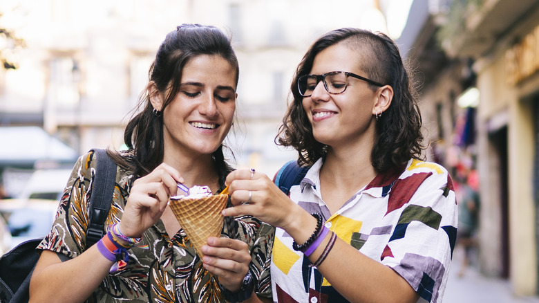 Female couple sharing dessert