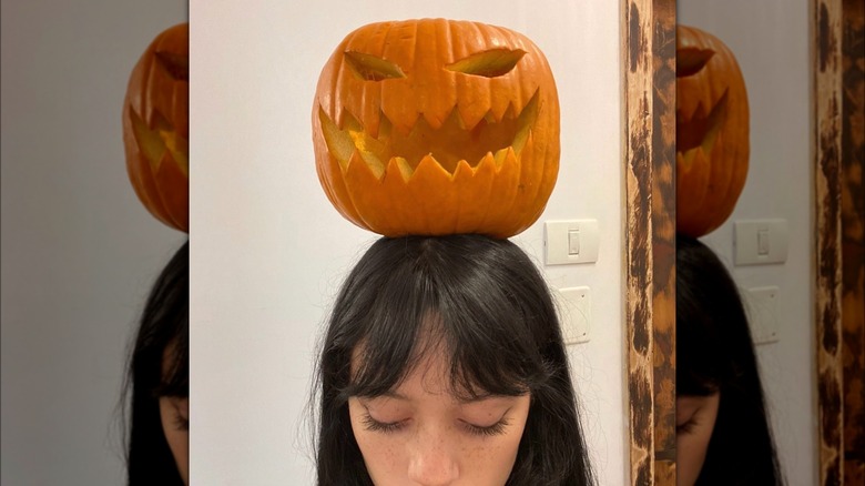 Jenna Ortega with a pumpkin