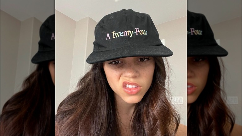 Jenna Ortega in a baseball cap