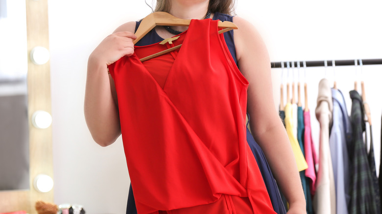 plus-sized shopper trying clothes