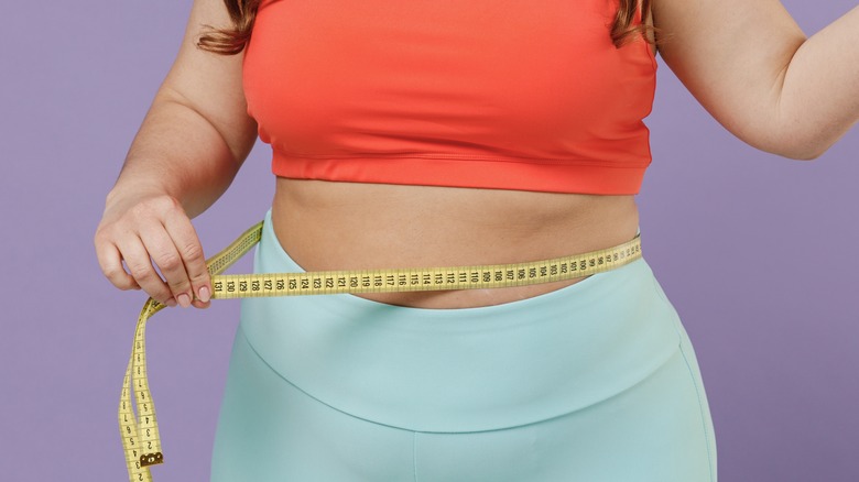 plus-sized female measuring body