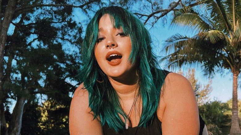 Woman with teal hair