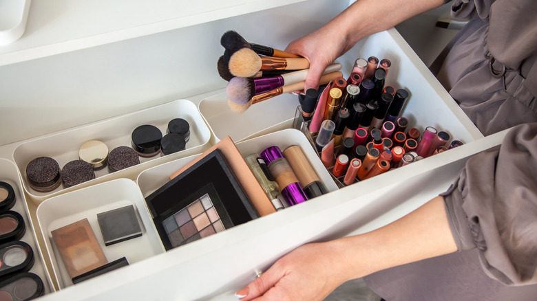 Woman organizing makeup