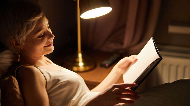 Woman reading in bed