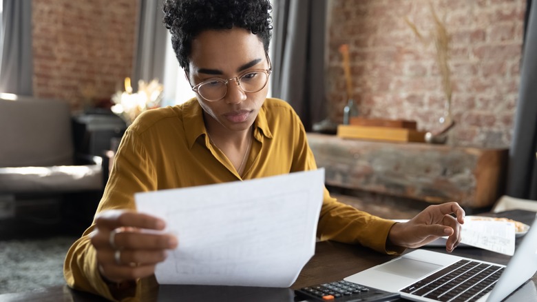 Woman looking at paper