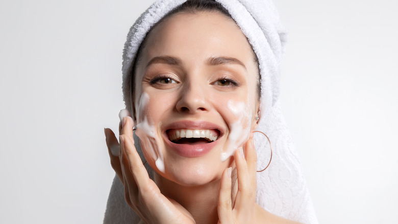 Woman washing face.