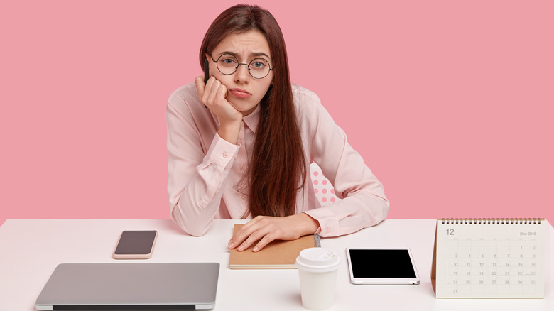 Woman worrying at desk