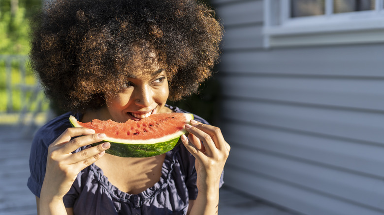 Woman eating watermelon