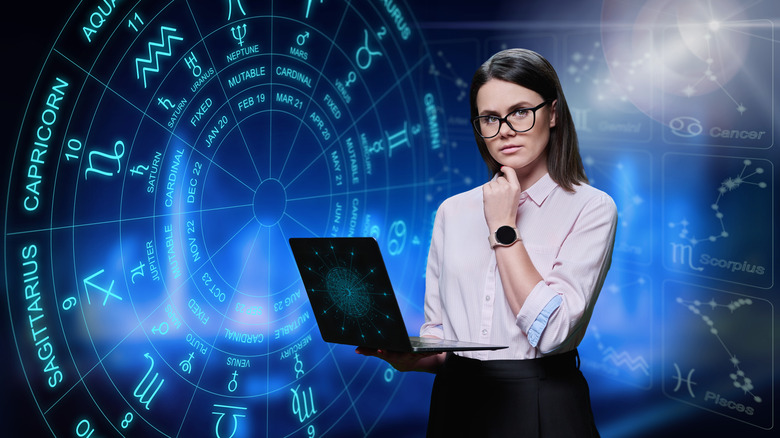 Professional woman holding laptop, astrological image