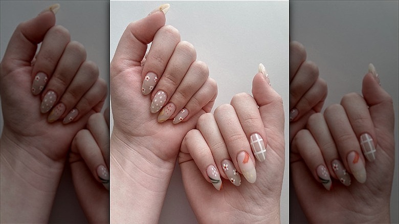 hands with mismatched floral manicure