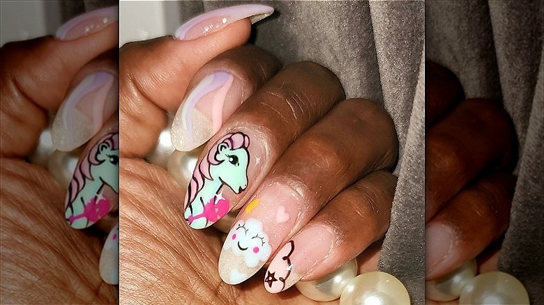 woman with mismatched pony manicure