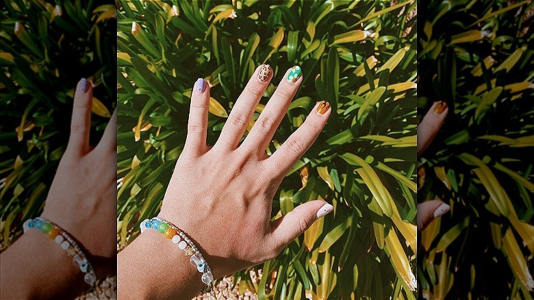 hand with mismatched nails