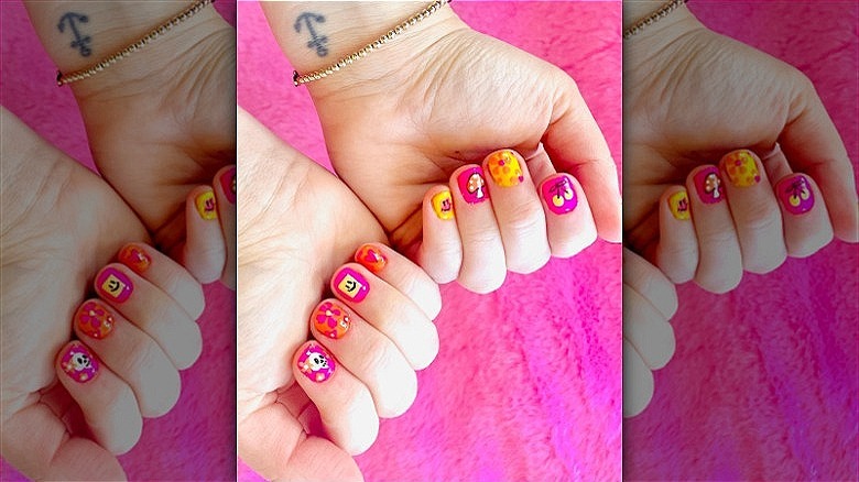 woman with retro mismatched manicure