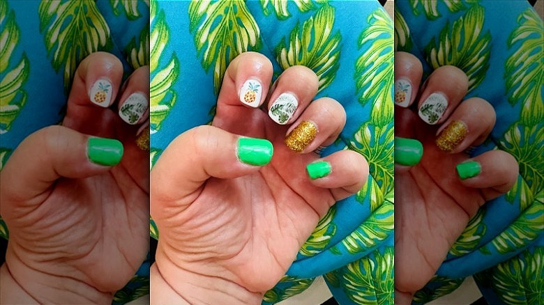 hand with mismatched summer nails