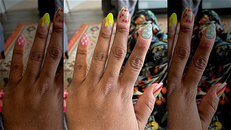 hands with mismatched summer manicure