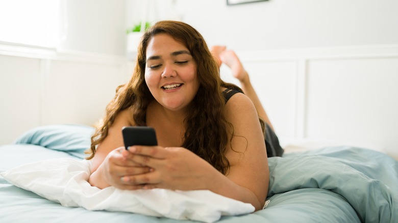 laughing texting woman