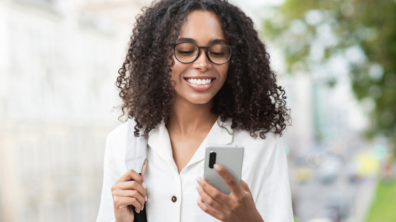 laughing woman texting