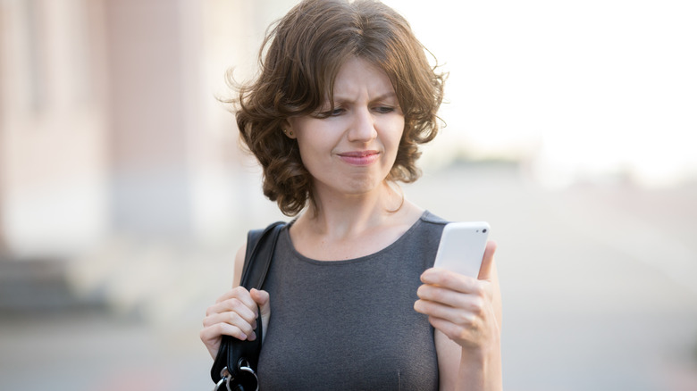 annoyed texting woman