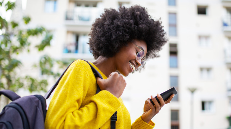 laughing texting woman