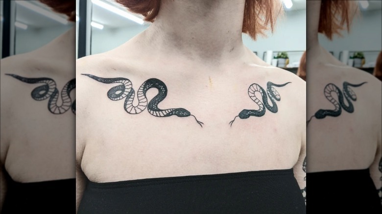 asymmetrical snakes collarbone tattoos