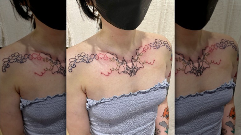 woman with abstract collarbone tattoo