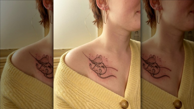 woman with mouse collarbone tattoo