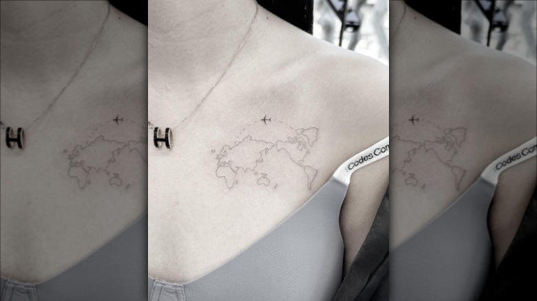 world map collarbone tattoo