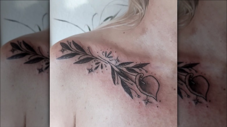 woman with flower collarbone tattoo