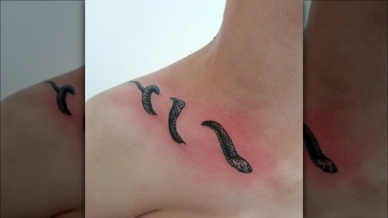 wraparound collarbone snake tattoo