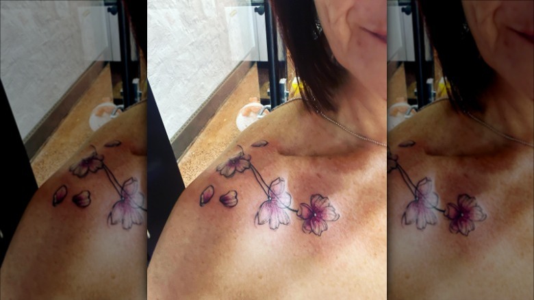 cherry blossoms collarbone tattoo