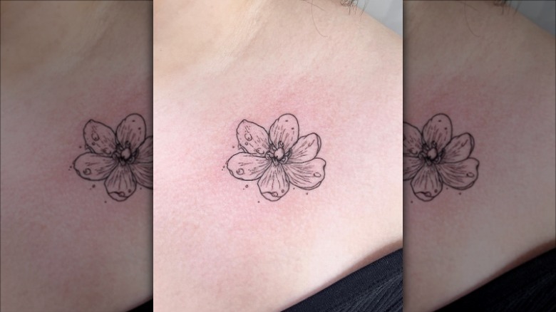 blooming flower collarbone tattoo