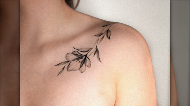 leafy branch collarbone tattoo