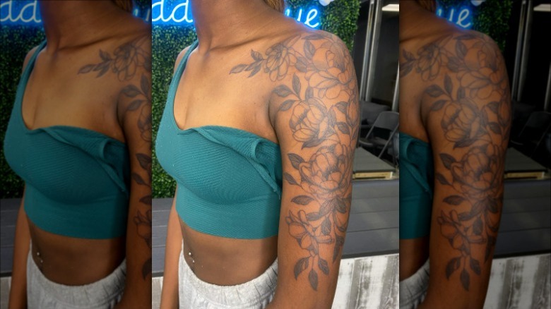 woman with flower arm tattoo