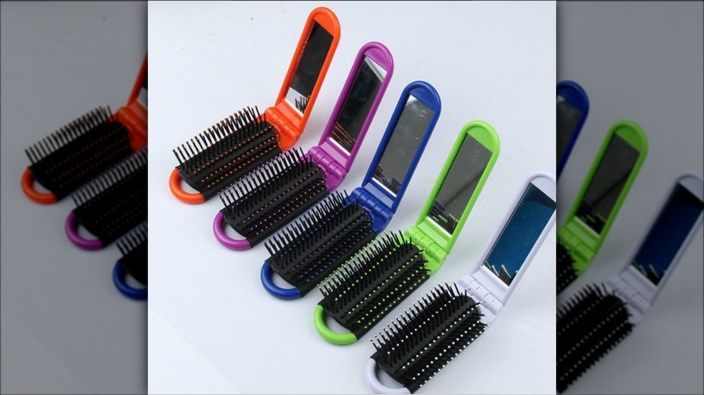 Folding hairbrushes in various colors