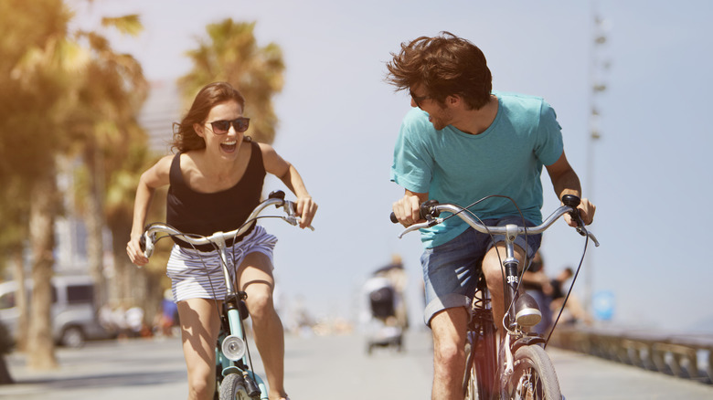 happy couple on bikes