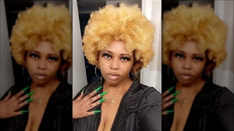 woman with big blonde afro