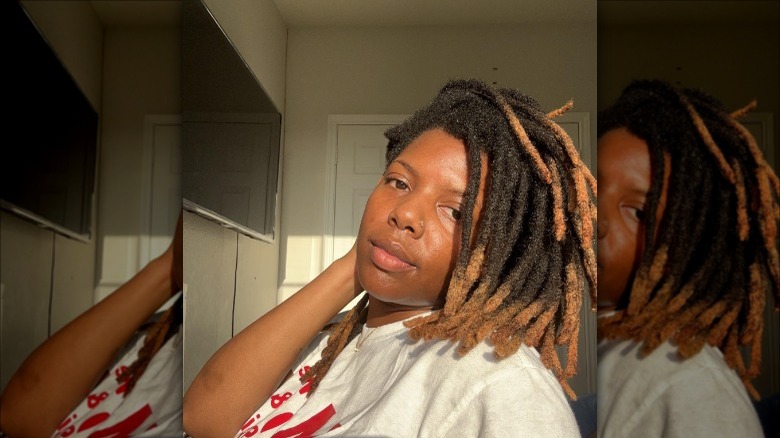 person with short dreadlocks