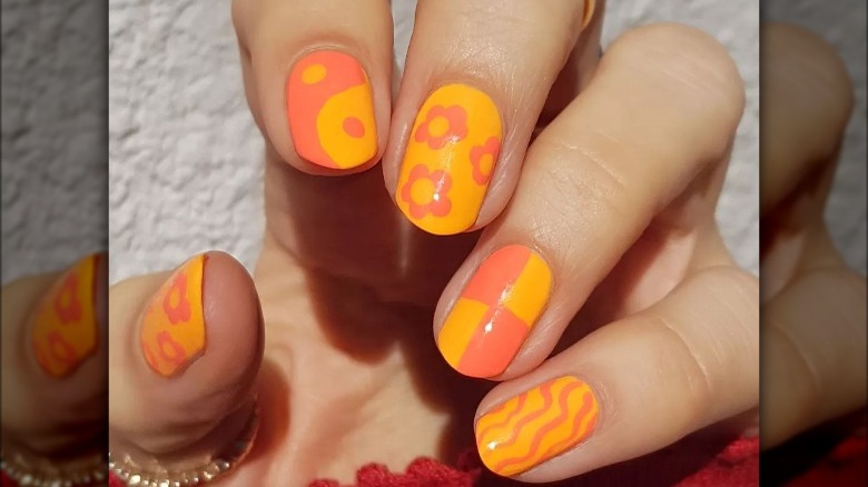 Orange and coral floral manicure