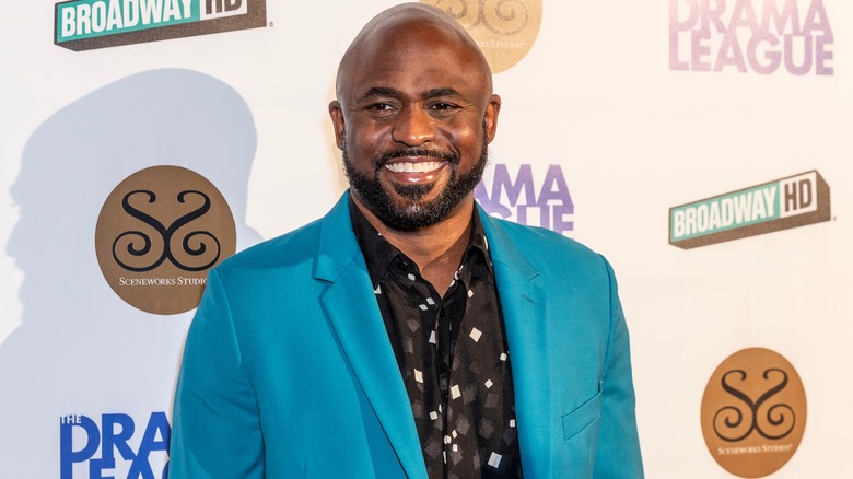 Smiling Wayne Brady blue blazer