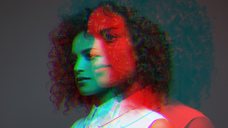 A woman's portrait doubled in red and green.