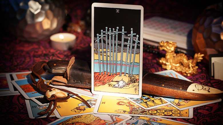 10 of swords tarot card upright