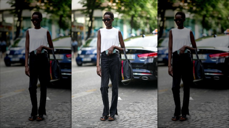 woman wearing dark denim jeans