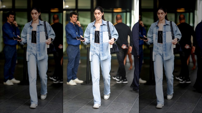 woman wearing denim jacket and jeans