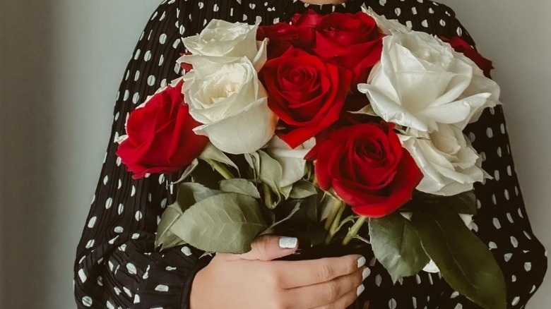 Woman holding roses 