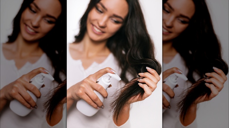 Woman applying hair product