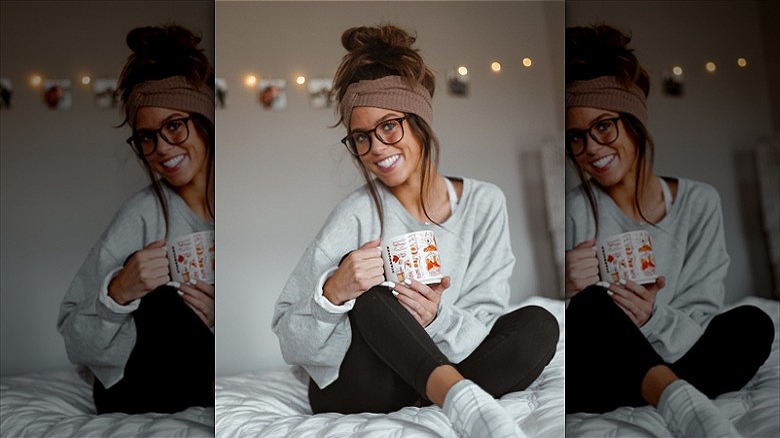 woman with hair in headband messy bun