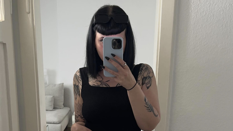 A woman with a micro bangs lob