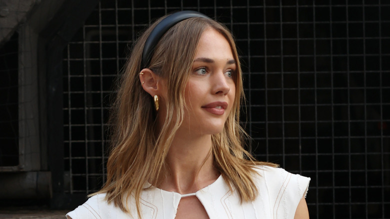 A woman with a white headband