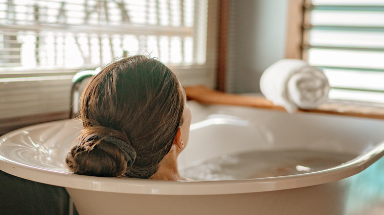 woman soaking in bath